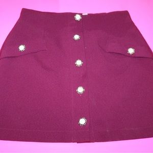 Burgundy pencil skirt with detailed buttons